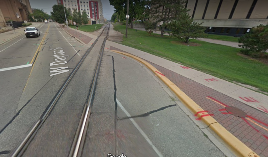 Image of bike/train track crossing in Madison, WI that is near-perpendicular