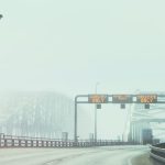 Bridge with signs in fog